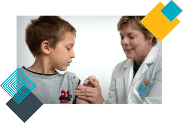 An experienced female pediatrician vaccinates a boy for health protection.