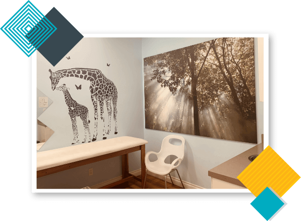 California Kids Pediatrics Clinic Care Unit with a mother and child giraffe painting and a tree portrait hanging on the wall.